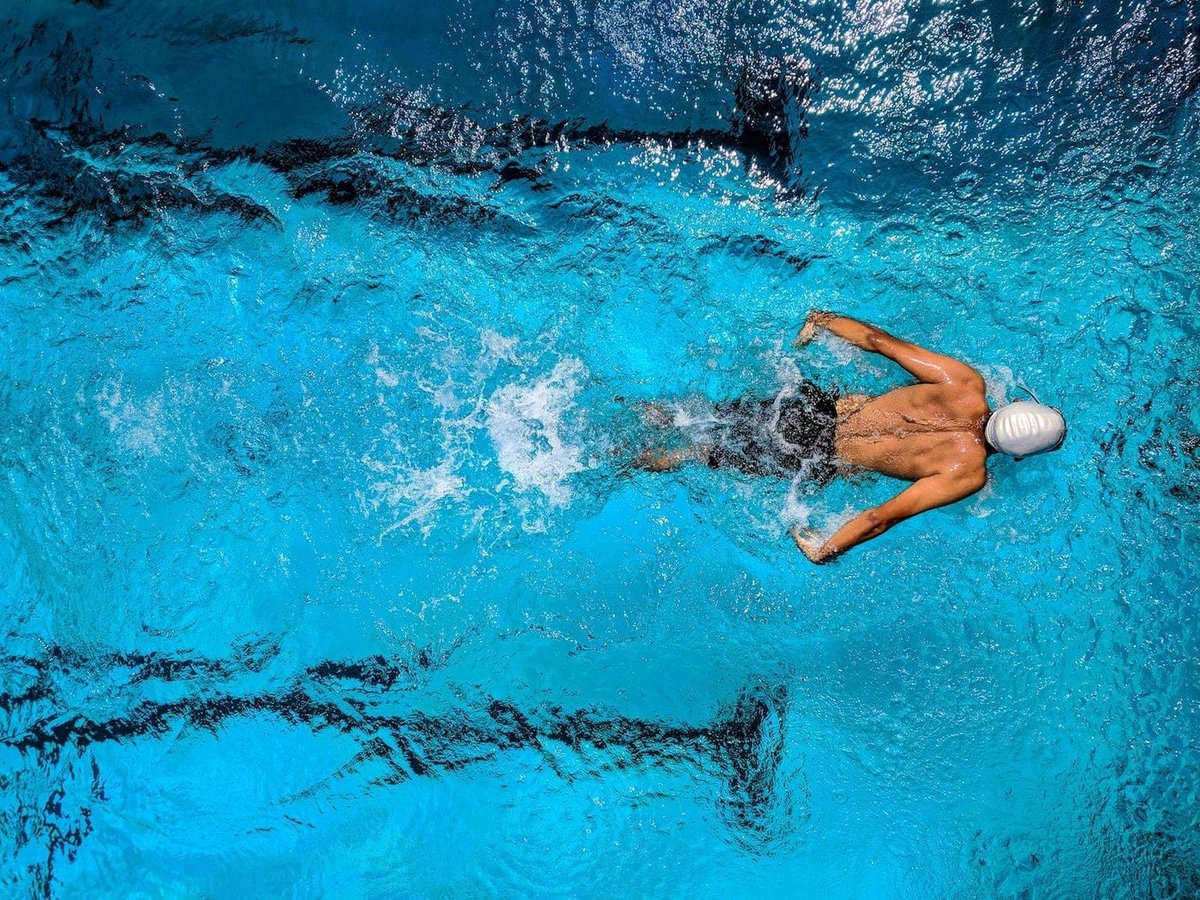 Athlete swimming after sports physical therapy at One Nine Sports Medicine